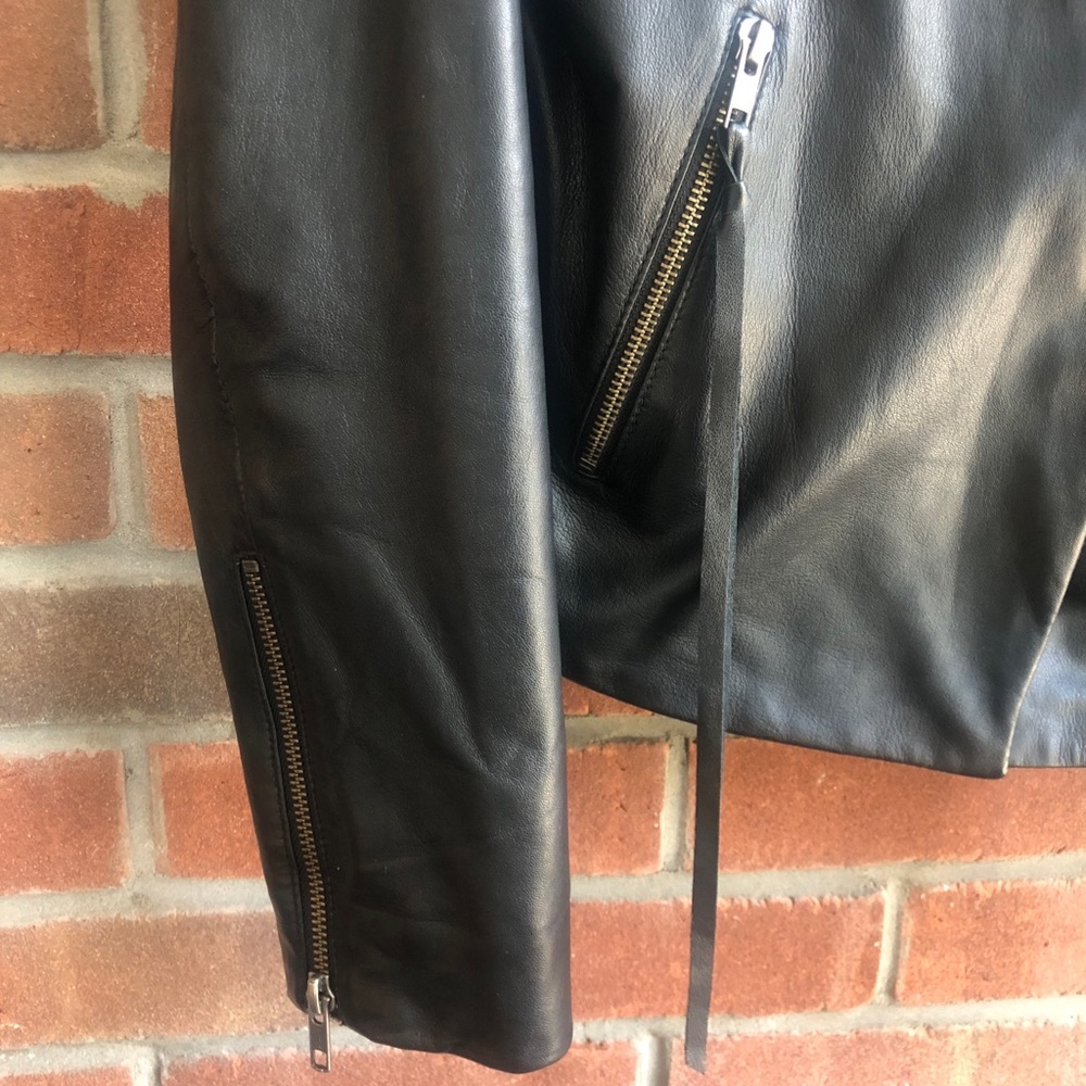 Black leather jacket with tassels